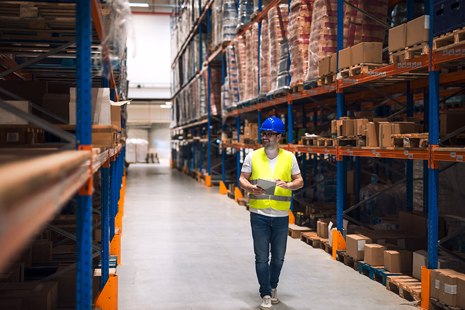 male walking through the warehouse